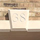 House number hand carved on site