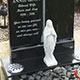 Hand carved angel headstone and kerb surround in dark grey granite