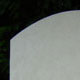 Oval top headstone in Portland stone